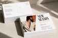 Stack of custom printed 24pt recycled uncoated postcards featuring a modern aesthetic design