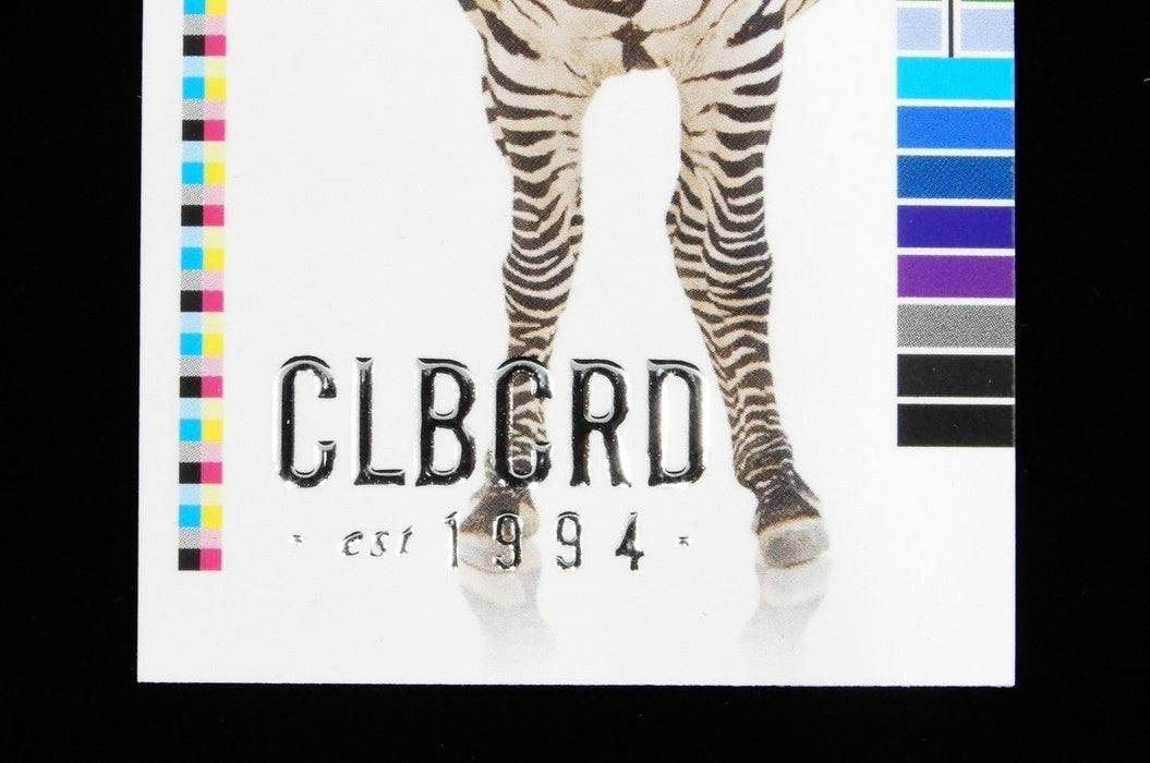 close-up of Clubcard sample card on 19pt suede stock featuring CLUBCARD logo and text in raised silver metallic foil