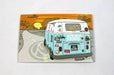 Full color postcard sample printed on Silk Laminated 19pt Stock | drawing of a van similar to a Volkswagen van with stickers on the back driving into a sunset | Clubcard Printing USA