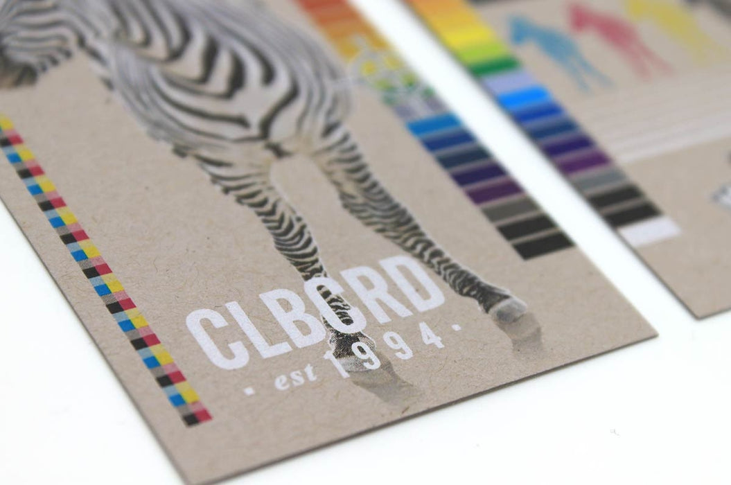 Close up of the white ink and our uncoated 20pt Concrete Grey stock | Clubcard Printing USA