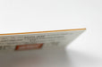 Close up showing the orange color core layer of our 37pt Uncoated Color Core stock | Clubcard Printing USA