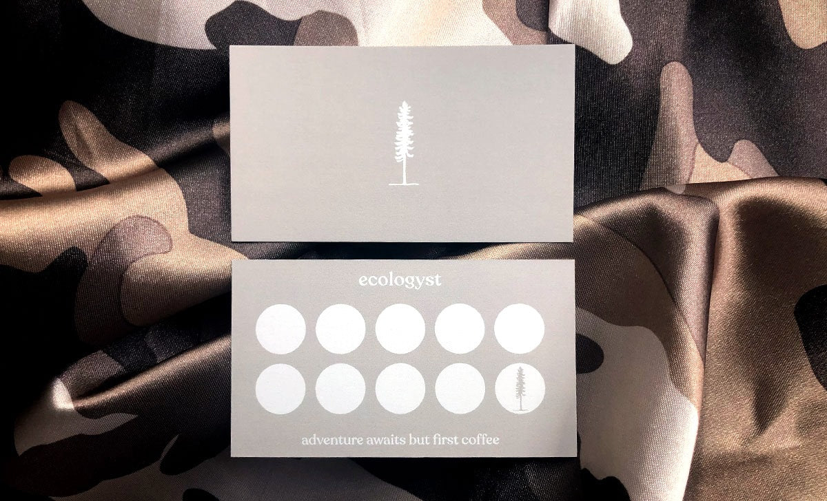 Custom loyalty stamp cards for Ecologyst on 15pt uncoated stock | one side has a single conifer tree, the other has 10 white circles for stamps | Clubcard Printing USA