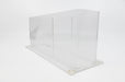 Side of a clear acrylic rack card stand on a white background.