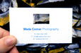 Custom business card for Wade Comer Photography | White background with blue text | Die cut rectangle above text center justified | Clubcard Printing USA