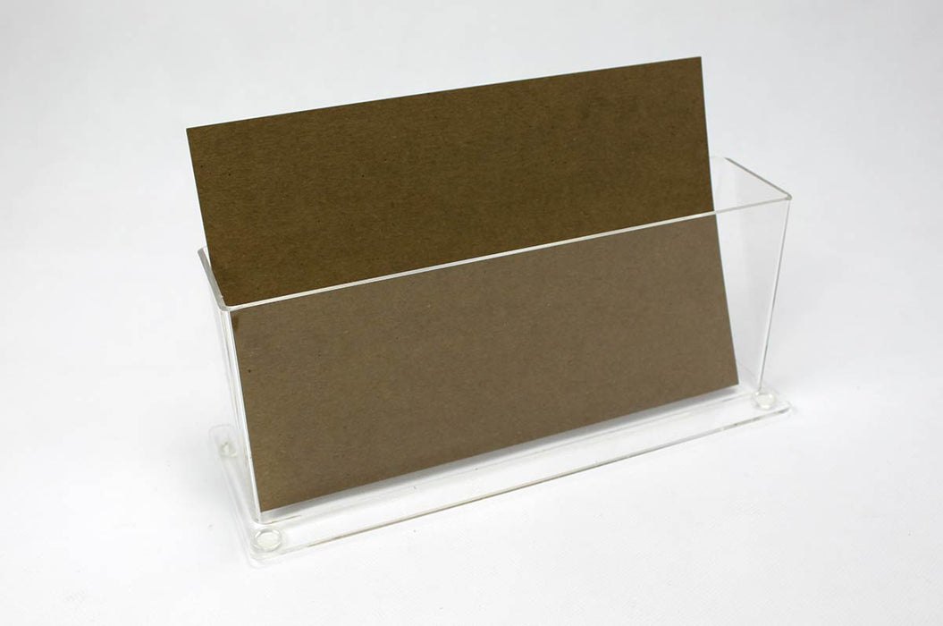 Clear acrylic postcard holder holding a kraft card on a white background.