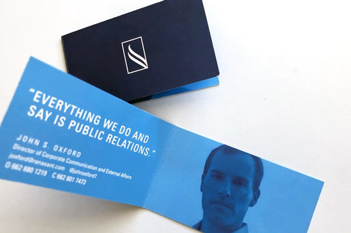 Folding business card printed on 14pt coated stock for Renasant | Business card is designed horizontally with the fold along the short side, and opens like a book | Clubcard Printing USA